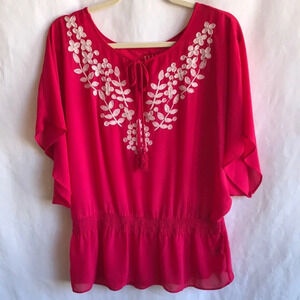 Elle semi-sheer pinkish red tie-neck top with cream floral embroidery